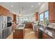 Spacious kitchen with granite countertops, stainless steel appliances, and a center island with cooktop at 3485 Park Ridge Rd, Sedalia, CO 80135