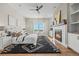 Cozy main bedroom with a fireplace, ceiling fan, hardwood floors and ample natural light at 3485 Park Ridge Rd, Sedalia, CO 80135