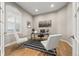 Bright home office featuring hardwood floors, modern decor, and ample natural light at 3485 Park Ridge Rd, Sedalia, CO 80135