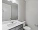 Bathroom features modern vanity with white countertop, mirror, toilet and neutral paint at 1860 Chaffee Crest Dr, Berthoud, CO 80513