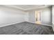 Bedroom featuring grey carpet, base trim, neutral paint, recessed lights and ensuite bathroom at 1860 Chaffee Crest Dr, Berthoud, CO 80513