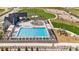 Community pool with lounge chairs, water features, and play areas; an inviting recreational space at 1860 Chaffee Crest Dr, Berthoud, CO 80513