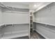 Spacious walk-in closet with ample shelving and rods for organization at 1860 Chaffee Crest Dr, Berthoud, CO 80513