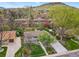 Sprawling neighborhood view with mature trees and greenery, showcasing the home's location and curb appeal at 2435 Creighton Dr, Golden, CO 80401