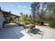 Spacious backyard patio with seating, a covered porch and manicured landscaping at 2435 Creighton Dr, Golden, CO 80401
