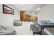 Finished basement featuring a mountain mural, carpeting, contemporary furniture and lots of space at 2435 Creighton Dr, Golden, CO 80401