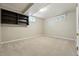 Unfinished basement room featuring carpeted floors, natural light, and blank canvas for customization at 2435 Creighton Dr, Golden, CO 80401