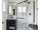 Stylish renovated bathroom features modern fixtures and glass enclosed shower at 2435 Creighton Dr, Golden, CO 80401