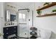 Modern bathroom with a glass-enclosed shower, white tiled walls, and stylish vanity with open shelving at 2435 Creighton Dr, Golden, CO 80401