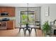 Cozy dining area with modern light fixture and sliding glass doors to outdoor patio at 2435 Creighton Dr, Golden, CO 80401