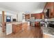 Spacious kitchen with stainless steel appliances and breakfast bar leading to the living area at 2435 Creighton Dr, Golden, CO 80401