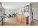 Bright kitchen with marble countertop, stainless steel appliances, and modern shelving at 2435 Creighton Dr, Golden, CO 80401