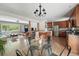 Open-concept living room flows into dining and kitchen with hardwood floors and lots of natural light at 2435 Creighton Dr, Golden, CO 80401