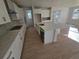 Well-lit kitchen with white cabinets, a center island with a sink, and stainless steel appliances at 5685 Farrier Pt, Castle Rock, CO 80104