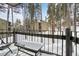 Inviting balcony view of a snow-covered community nestled among towering trees, creating a serene mountain retreat at 1173 Ski Hill Rd # 127, Breckenridge, CO 80424