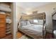 Bedroom featuring wooden bunk beds with wood floors, and a window at 1173 Ski Hill Rd # 127, Breckenridge, CO 80424