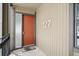 Condo entrance featuring a red door with a welcome mat and the unit number at 1173 Ski Hill Rd # 127, Breckenridge, CO 80424