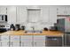 Well-lit kitchen with stainless steel appliances and butcher block countertops at 1173 Ski Hill Rd # 127, Breckenridge, CO 80424