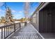 The deck's expansive size and snow-dusted surface offers a picturesque outdoor area at 7863 Windfont Row, Parker, CO 80134