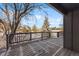 An expansive, partially snow-covered deck offers an inviting outdoor space at 7863 Windfont Row, Parker, CO 80134