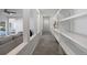 Hallway featuring open shelving, modern lighting, and neutral carpet throughout for an airy, updated feel at 7863 Windfont Row, Parker, CO 80134
