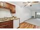 Bright kitchen features granite countertops, wood cabinets, and modern appliances at 610 S Alton Way # 8D, Denver, CO 80247