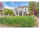 Backyard with lush lawn and patio, ideal for outdoor living and entertaining at 618 Fairchild Dr, Highlands Ranch, CO 80126