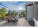 Relaxing outdoor deck with comfortable sofa, table, and grill, perfect for entertaining or relaxing at 618 Fairchild Dr, Highlands Ranch, CO 80126
