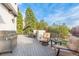 Spacious deck featuring a grill, comfortable seating, and views of the surrounding landscape at 618 Fairchild Dr, Highlands Ranch, CO 80126