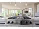 Gourmet kitchen featuring Viking Professional gas range and large island, perfect for cooking and entertaining at 618 Fairchild Dr, Highlands Ranch, CO 80126