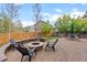 Beautiful backyard with a cozy fire pit area, built-in seating, and lush green lawn for outdoor enjoyment at 12017 W Cross Dr, Littleton, CO 80127