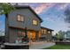 Back patio features a built-in grill, fire pit, and space to relax at 12017 W Cross Dr, Littleton, CO 80127