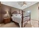 Bedroom with a four-poster bed, vaulted ceiling, and soft lighting at 12017 W Cross Dr, Littleton, CO 80127