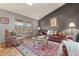 Cozy living room with hardwood floors, a neutral color palette, and comfortable seating at 12017 W Cross Dr, Littleton, CO 80127