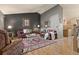 Well-lit living room with hardwood floors, a comfortable seating arrangement and decor at 12017 W Cross Dr, Littleton, CO 80127