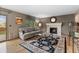 Cozy living room features a fireplace, hardwood floors, and natural light at 12017 W Cross Dr, Littleton, CO 80127