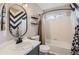 Stylish bathroom features a modern vanity, decorative mirror, and tiled shower, offering a fresh and inviting space at 3805 E 106Th Ave, Thornton, CO 80233