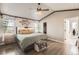 Cozy main bedroom featuring vaulted ceilings, natural light, and an ensuite bathroom at 3805 E 106Th Ave, Thornton, CO 80233