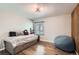 Charming bedroom featuring a built-in bed frame and wood flooring at 3805 E 106Th Ave, Thornton, CO 80233