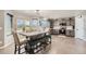 Bright kitchen with a dining area, stainless steel appliances and gray cabinetry at 3805 E 106Th Ave, Thornton, CO 80233
