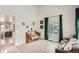 Bright and airy living room with a piano, large window, and stylish decor, creating a cozy and inviting atmosphere at 3805 E 106Th Ave, Thornton, CO 80233