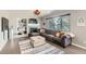 Comfortable living room with large sectional sofa, fireplace, and decorative accents at 3805 E 106Th Ave, Thornton, CO 80233