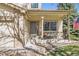 Cozy front porch with bench seating, decorative plants, and an American flag, offering a welcoming entrance to the home at 3805 E 106Th Ave, Thornton, CO 80233
