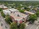 Bird's eye view showcasing a multi-unit residential building in a tree-lined neighborhood at 790 N Clarkson St # 206, Denver, CO 80218