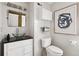 Modern bathroom with sleek fixtures, stylish lighting, decorative art, and a glass vessel sink at 790 N Clarkson St # 206, Denver, CO 80218