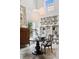 Bright dining room featuring stylish decor, round table, and a bookshelf filled with sculptures at 790 N Clarkson St # 206, Denver, CO 80218