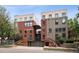Exterior view of modern apartment buildings, featuring brick facades and convenient covered parking at 790 N Clarkson St # 206, Denver, CO 80218