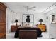 Bedroom featuring hardwood floors, bright lighting, art, black bedding, and decorative wood chest at 790 N Clarkson St # 206, Denver, CO 80218