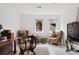 Well-lit office with two chairs, rug, and an antique cabinet with light neutral tones at 790 N Clarkson St # 206, Denver, CO 80218