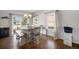 Bright dining room with a table, chairs, bench seating, and wood floors at 5475 Shoshone Dr, Longmont, CO 80504